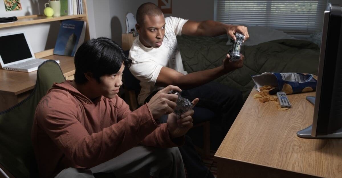 Teens playing playstation video game