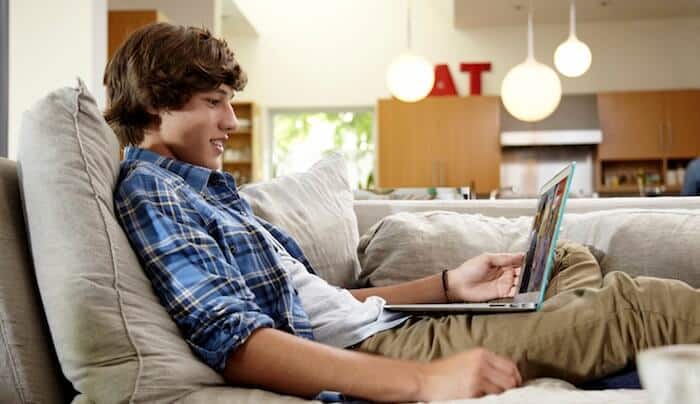 Young person watching video on his laptop